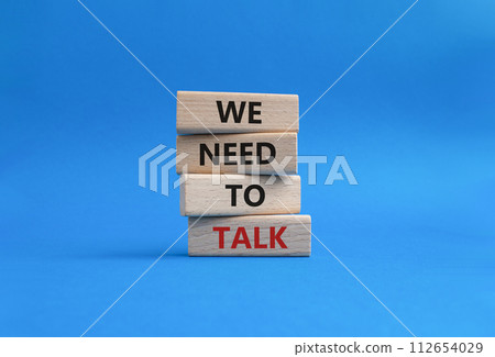 We need to talk symbol. Concept words We need to talk on wooden blocks. Beautiful blue background. Business and We need to talk concept. Copy space. We need to talk symbol. Concept words We need to talk on wooden blocks. Beautiful blue background. Business and We need to talk concept. Copy space. 112654029