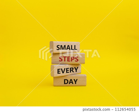 Small Steps Every Day symbol. Wooden blocks with words Small Steps Every Day. Beautiful yellow background. Business and Small Steps Every Day concept. Copy space. 112654055