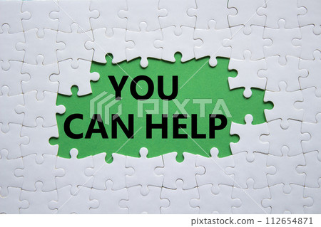 You can help symbol. Concept words You can help on white puzzle. Beautiful green background. Business and You can help concept. Copy space. 112654871