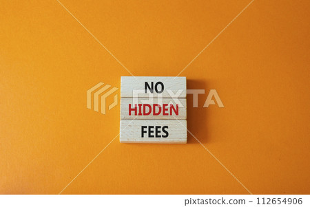 No hidden fees symbol. Concept word No hidden fees on wooden blocks. Beautiful orange background. Business and No hidden fees concept. Copy space 112654906