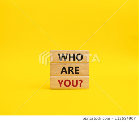 Who are You symbol. Concept words Who are You on wooden blocks. Beautiful yellow background. Business and Who are You concept. Copy space. Who are You symbol. Concept words Who are You on wooden blocks. Beautiful yellow background. Business and Who are You concept. Copy space. 112654907