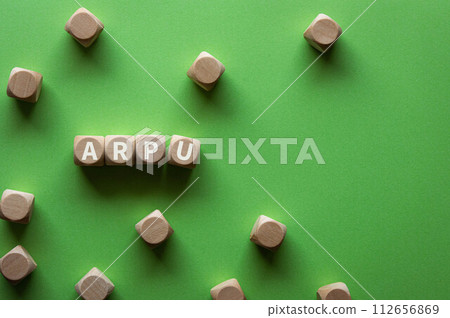 There is a Wood Cube with the word Arpu. 112656869