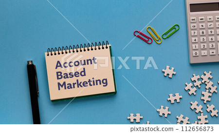 I have a notebook that contains the word account-based marketing. As an eye-catching image. I have a notebook that contains the word account-based marketing. As an eye-catching image. 112656873