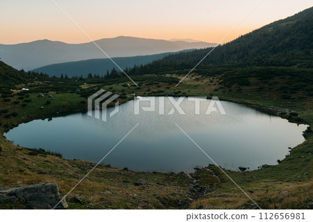 Beautiful mountain lake Vorozheska on Svydovets ridge in the morning. Ukraine. Carpathians. 112656981
