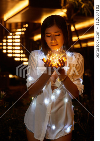 Young asian woman in a white shirt posing at hotel territory 112657182