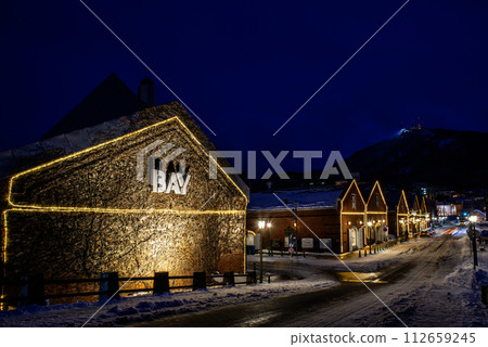 Kanemori Red Brick Warehouse and Mt. Hakodate illuminated in the snow Kanemori Red Brick Warehouse and Mt. Hakodate illuminated in the snow 112659245