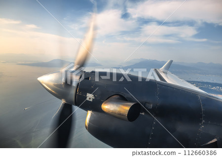 Jet engine propeller from window on a flight 112660386