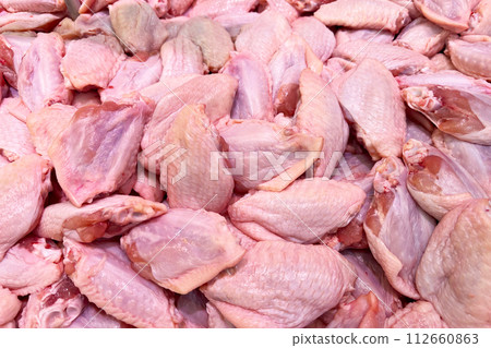 Uncooked chicken wings. Raw chicken meat Uncooked chicken wings. Raw chicken meat 112660863
