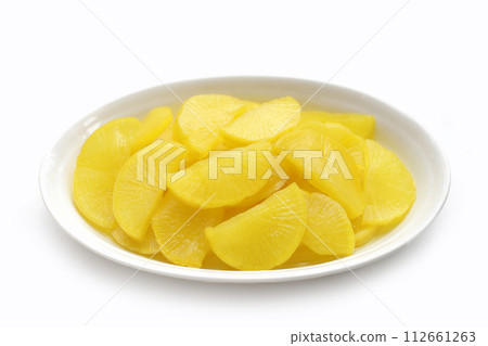Sweet and tart slices of yellow pickled daikon, known as takuan in Japan and danmuji in Korea. 112661263
