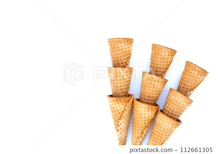 Empty ice cream cone on white background. Empty ice cream cone on white background. 112661305