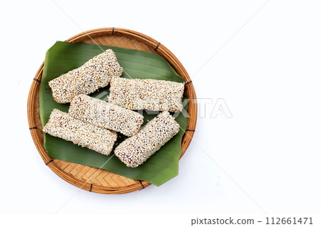 White sesame rolls with peanut. Sweetened dessert White sesame rolls with peanut. Sweetened dessert 112661471