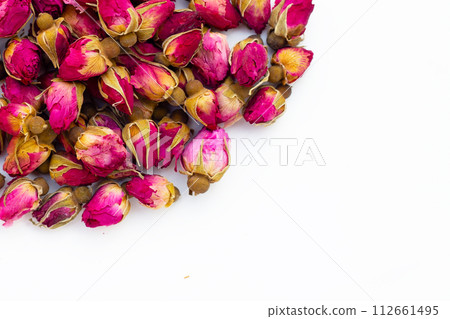 Dried roses for tea on white background. Dried roses for tea on white background. 112661495