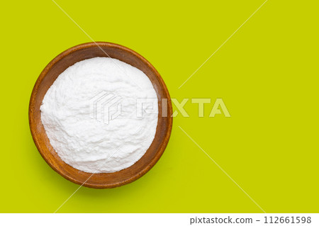 Baking soda on green background. Baking soda on green background. 112661598