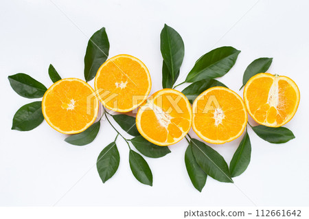 Orange fruit with green leaves on white background. Orange fruit with green leaves on white background. 112661642