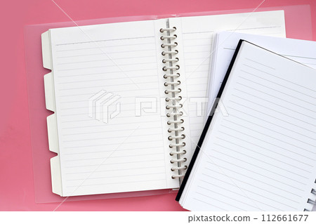 Notebook on pink background. Work planning Notebook on pink background. Work planning 112661677