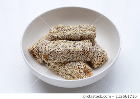 White sesame rolls with peanut. Sweetened dessert 112661710