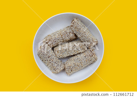 White sesame rolls with peanut. Sweetened dessert White sesame rolls with peanut. Sweetened dessert 112661712