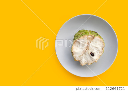 Custard apple fruit on yellow background. 112661721