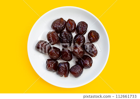 Sweet chinese jujube dessert on yellow background. 112661733