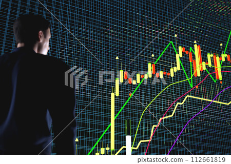 Price movement chart with indicators and volumes. The trader analyzes the price movement on a huge trading chart. A businessman-investor observes an increase in the price of an asset 112661819