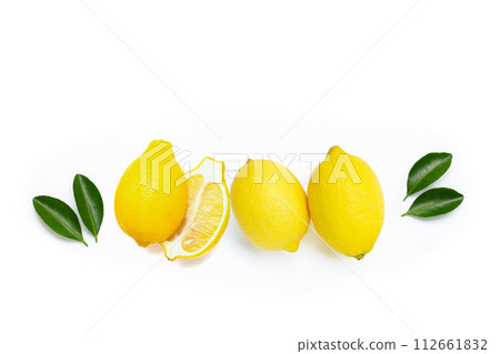 Fresh lemon with green leaves on white. Fresh lemon with green leaves on white. 112661832