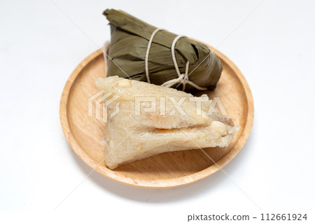 Chinese rice dumpling (zongzi) on white background. Chinese rice dumpling (zongzi) on white background. 112661924