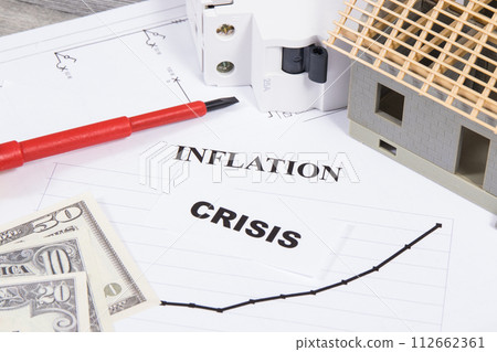 Electric fuse, screwdriver, small house under construction and currencies Dolar 112662361