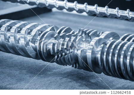 Close up scene group of the barrel screw of injection machine spare parts. Close up scene group of the barrel screw of injection machine spare parts. 112662458