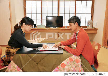 Travel planning: spread out the map in a Japanese-style room Travel planning: spread out the map in a Japanese-style room 112663823