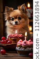 A luxurious cake with cherries arranged in a heart shape, next to it is a chihuahua 112663894