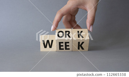 Work Week symbol. Businessman hand Turns cubes with words Work Week. Beautiful grey background. Business and Work Week concept. Copy space Work Week symbol. Businessman hand Turns cubes with words Work Week. Beautiful grey background. Business and Work Week concept. Copy space 112665338