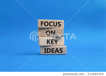 Focus on Key Ideas symbol. Concept words Focus on Key Ideas on wooden blocks. Beautiful blue background. Business and Focus on Key Ideas concept. Copy space Focus on Key Ideas symbol. Concept words Focus on Key Ideas on wooden blocks. Beautiful blue background. Business and Focus on Key Ideas concept. Copy space 112665430
