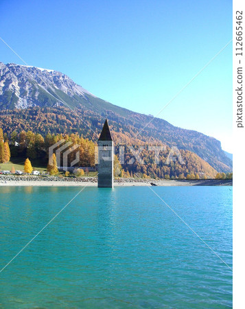 Belfry half buried in the lake, Lake Resia, South Tyrol 112665462