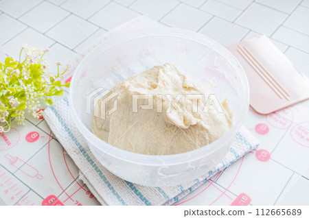 Bread making: Dough kneaded after primary fermentation 112665689