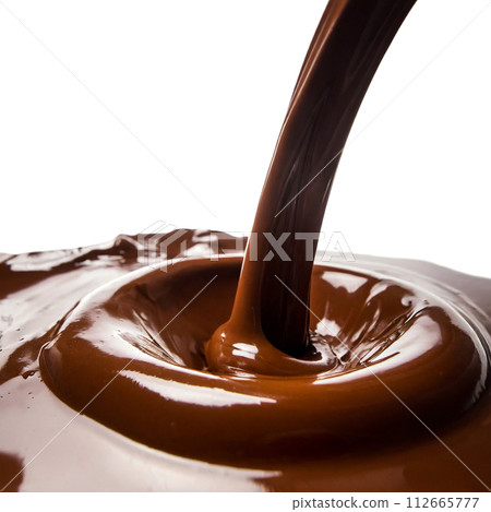 Melted chocolate flowing on a white background 112665777