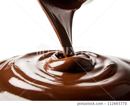 Melted chocolate flowing on a white background 112665778
