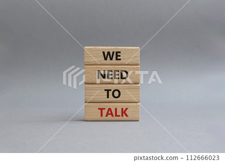 We need to talk symbol. Concept words We need to talk on wooden blocks. Beautiful grey background. Business and We need to talk concept. Copy space. We need to talk symbol. Concept words We need to talk on wooden blocks. Beautiful grey background. Business and We need to talk concept. Copy space. 112666023