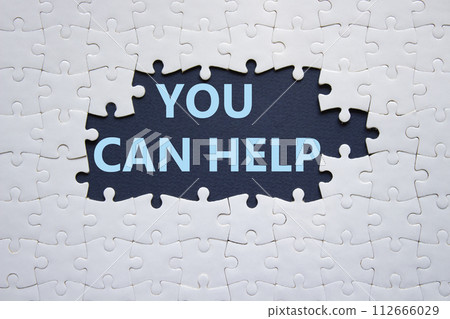 You can help symbol. Concept words You can help on white puzzle. Beautiful deep blue background. Business and You can help concept. Copy space. 112666029