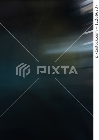 Abstract effect in dark tones, blur in the movement of light from the lights on the old wall at night. Background for design with copy space. Vertical orientation. Copy space Abstract effect in dark tones, blur in the movement of light from the lights on the old wall at night. Background for design with copy space. Vertical orientation. Copy space 112666237