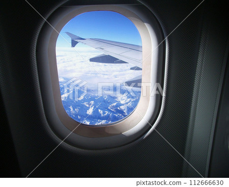 Airplane window, window bound for Europe, Alps 112666630