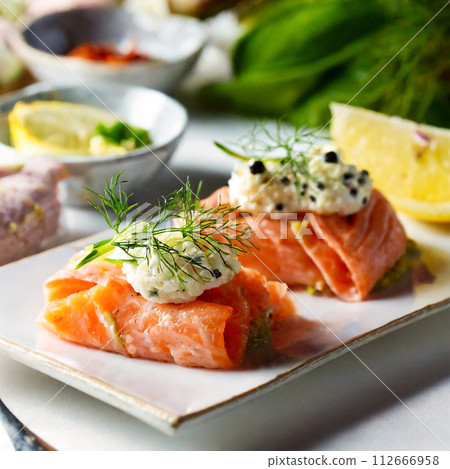 Marinated smoked salmon on a white plate Marinated smoked salmon on a white plate 112666958
