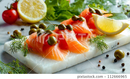 smoked salmon on a white plate 112666965