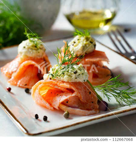 Marinated smoked salmon on a white plate Marinated smoked salmon on a white plate 112667068