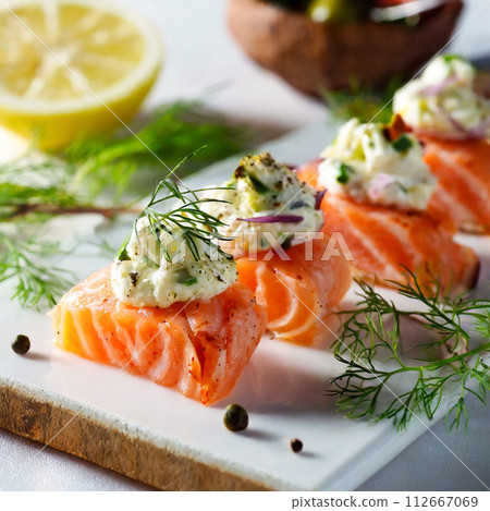Marinated smoked salmon on a white plate Marinated smoked salmon on a white plate 112667069