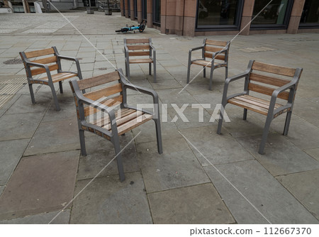 These street chairs look casually placed, but they're screwed into the floor for People can comfortably sit together. These street chairs look casually placed, but they're screwed into the floor for People can comfortably sit together. 112667370