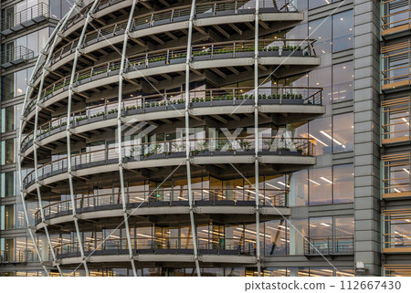 Modern architectural design of Riverside House. Exterior detail of Curved building. 112667430