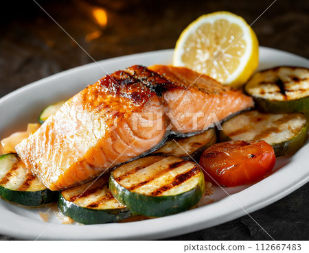 Deluxe dinner plate of sauteed salmon and grilled vegetables Deluxe dinner plate of sauteed salmon and grilled vegetables 112667483