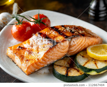 Deluxe dinner plate of sauteed salmon and grilled vegetables Deluxe dinner plate of sauteed salmon and grilled vegetables 112667484