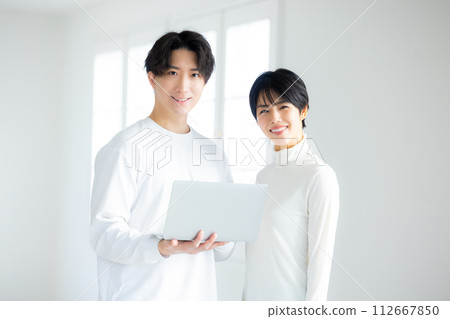 A couple in the living room A couple in the living room 112667850