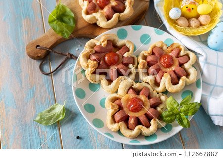 Pizza in puff pastry with cheese and tomatoes. 112667887